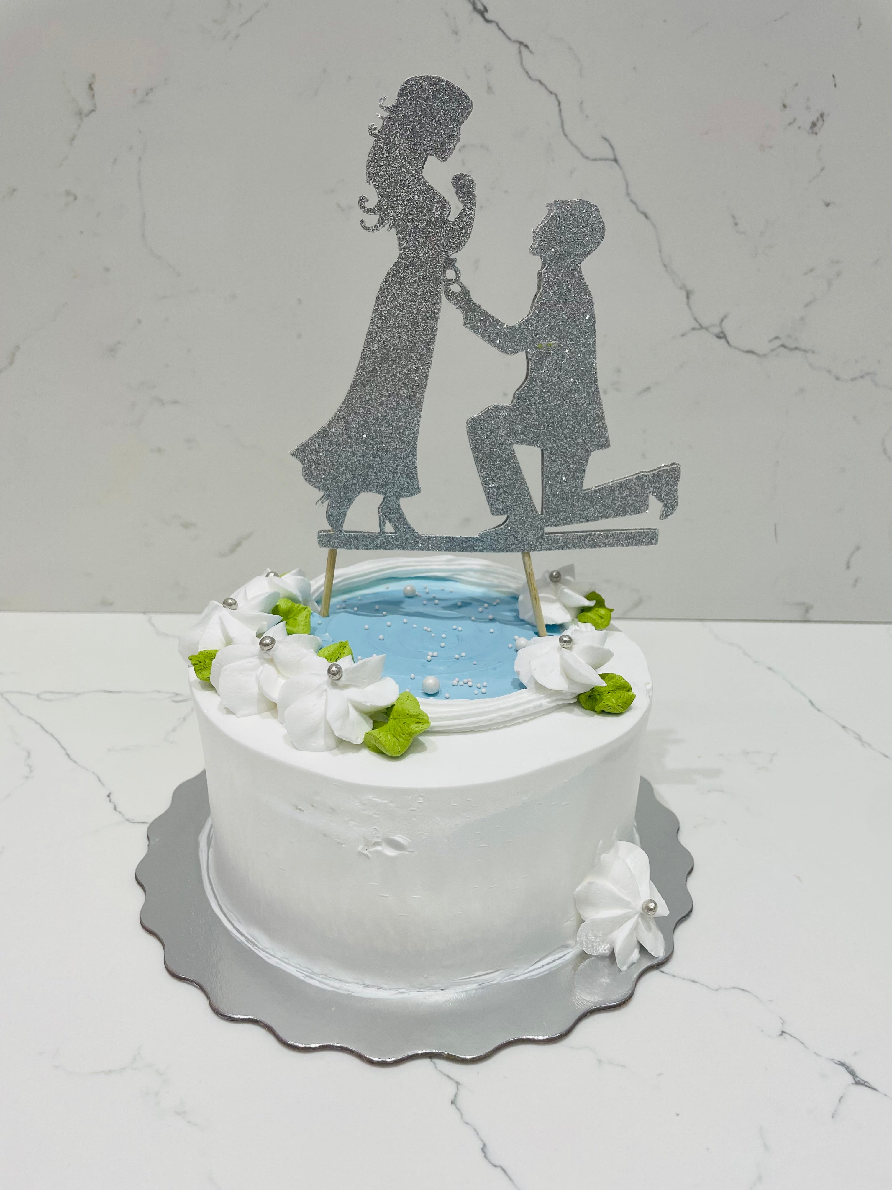 Proposal on the beach cake